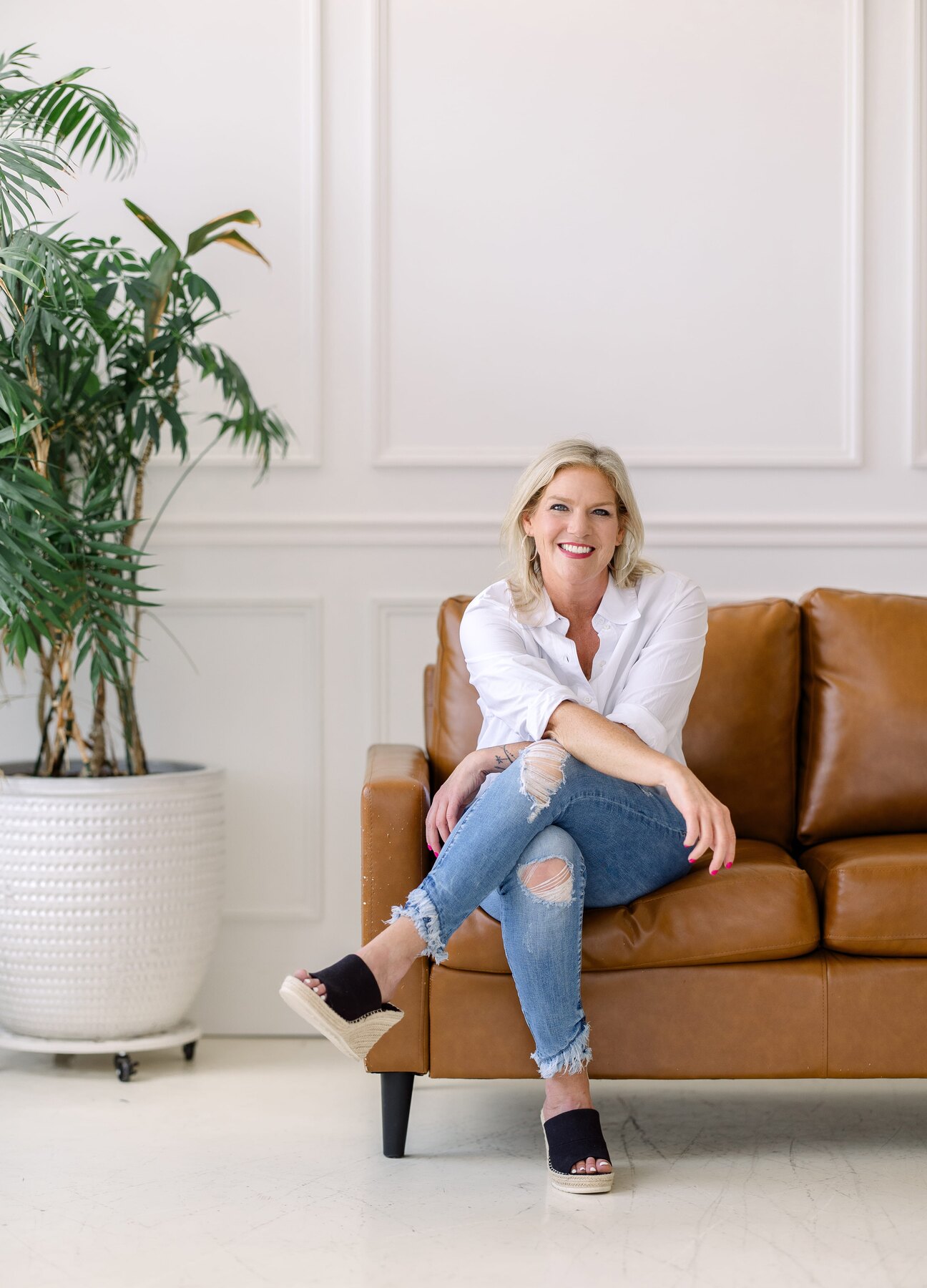 Brooke Dunwell seated in her coaching studio